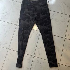 Black and grey army fatigue leggings.